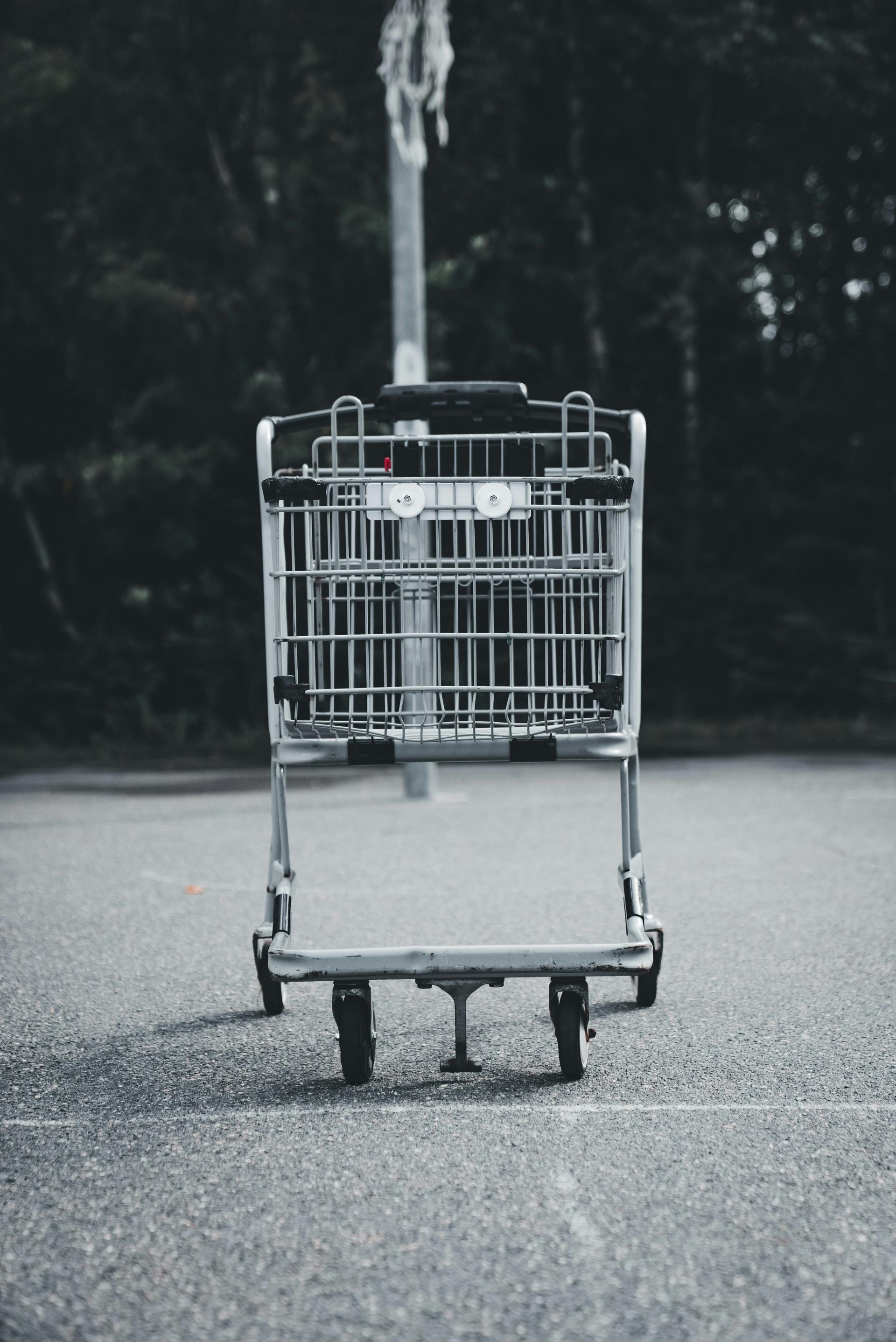 Shopping cart in empty parking lot